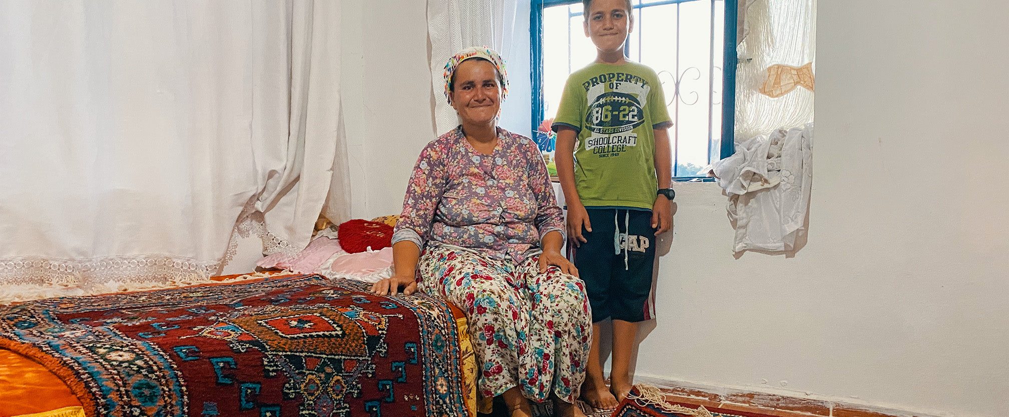 Hatice and his son, showed us her loom, and nestled inside was the most intricate and vibrant rug. She was in the process of hand-weaving it together, between looking after her family and farm.